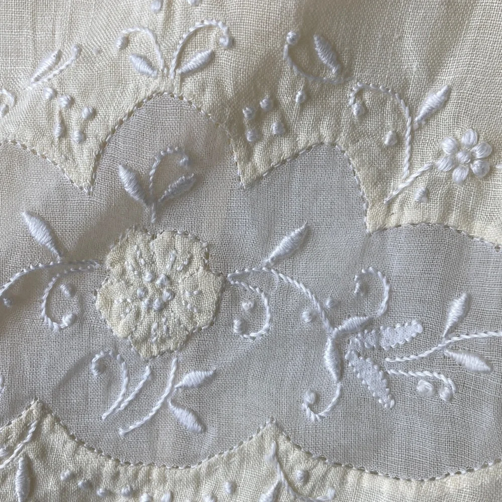 One fine linen embroidered tea towels. A muted butter yellow Vintage 1960s